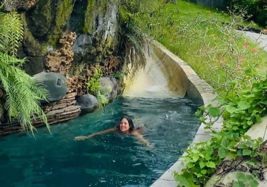 The swimming pool had a jungle slide and waterfall.