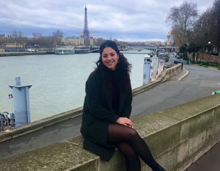 Sitting on the wall along the River Seine during our Paris trip weekend