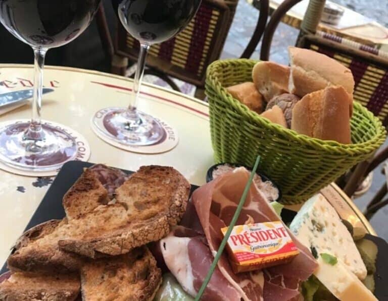 Paris cafes are great places to warm up in winter: be sure to order a sharing plater and wine