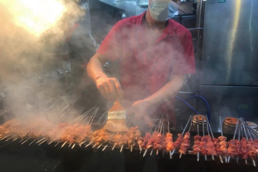 During your 5 days in Singapore try the satay - grilled meats on sticks - at any hawker centre.