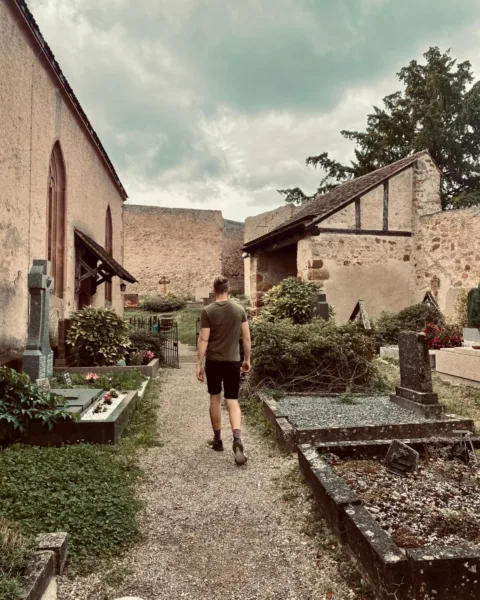 Jack walking inside Saint-Jacques-le-Majeur courtyard