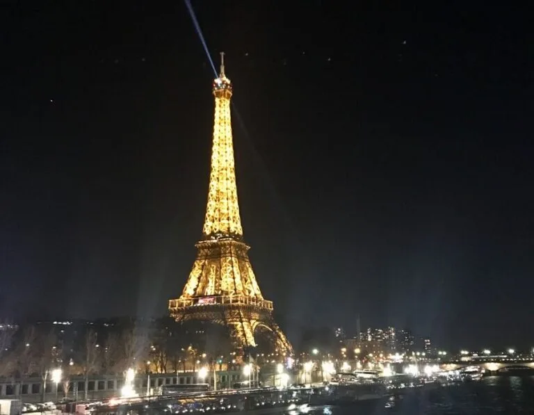 The Eiffel Tower at night time from the river