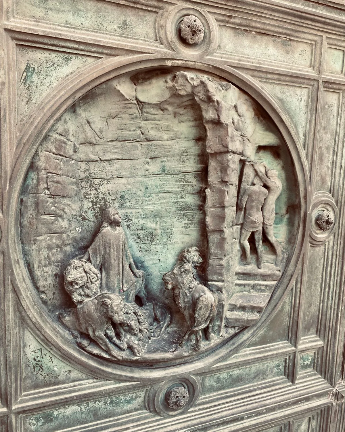 Close up of the detail on the doors to the Basilica of Mary the Assumption, Sacro Monte, Varallo, Italy.