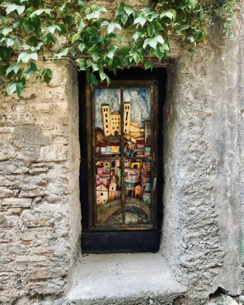 Painted timber shutters of Dolceacqua, Italy