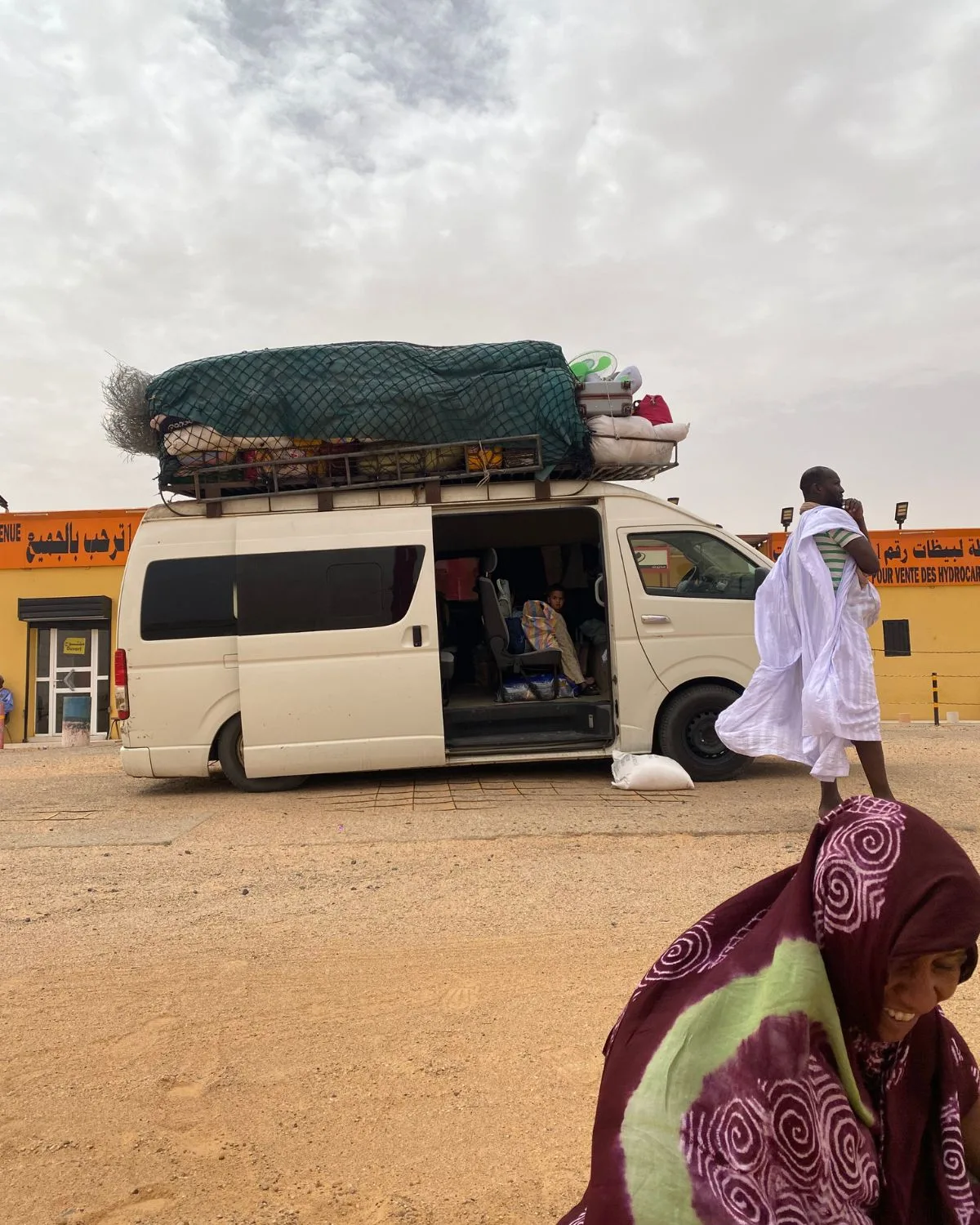 A shared taxi in Mauritania parked during prayer time.