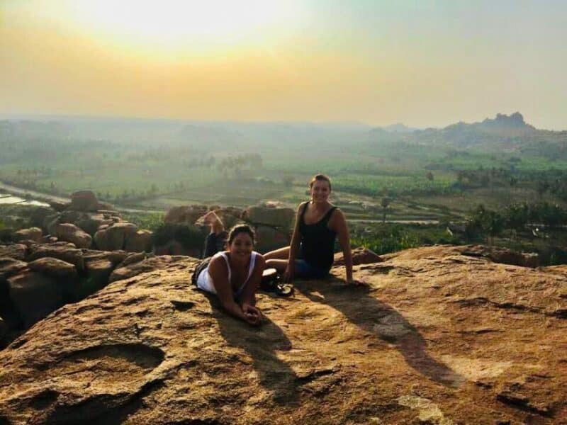 Abi travelling with someone while enjoying the sunset in Hampi, India