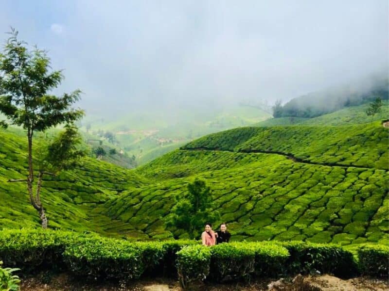 Abi travelling with someone in India's tea plantations