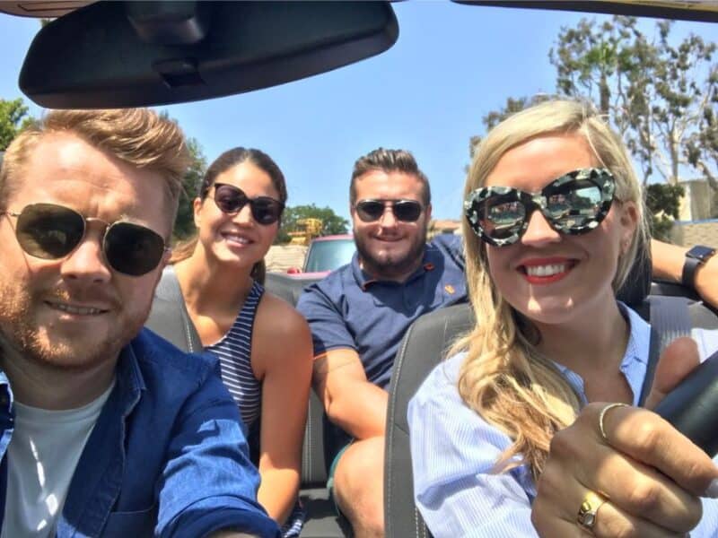 Abi with friends inside an open-top car in LA.
