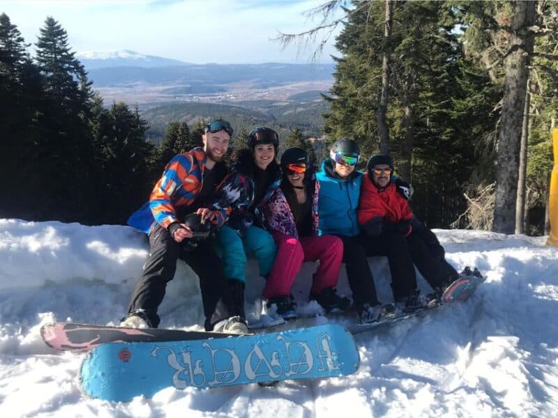 Abi with friends on a mountain on a snowboarding trip in Borovets.