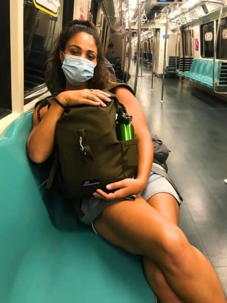 Abi alone on a train in Singapore
