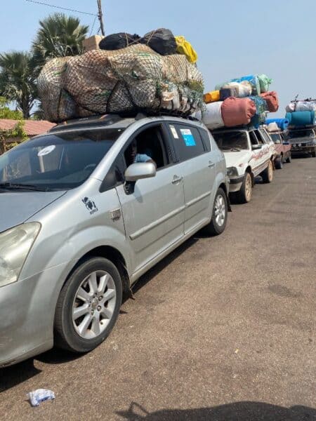 Row of cars at border in West Africa
