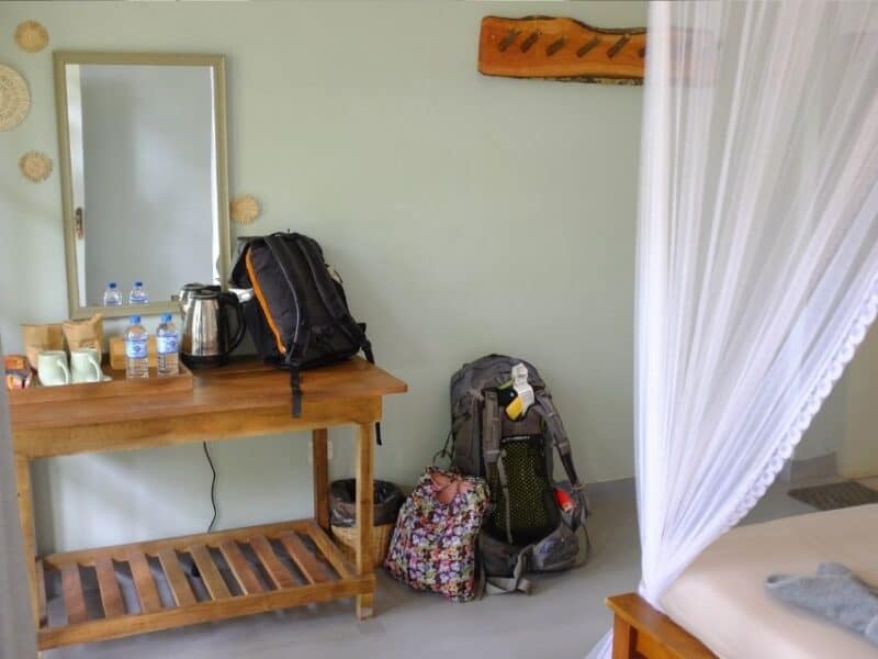 Deluxe double room at Ella Ceylonka with mosquito net bed and tea station.