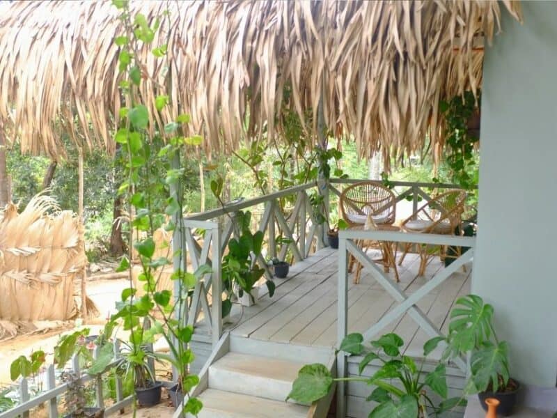 Raised veranda and steps leading to rooms at Ella Ceylonka guesthouse.