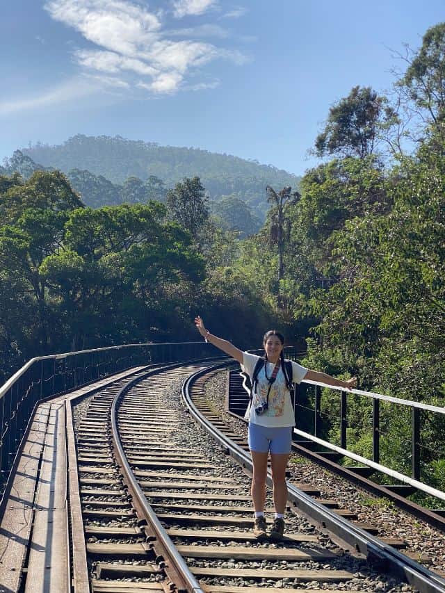 Woman standing on a railway bridge in Ella, Sri Lanka
