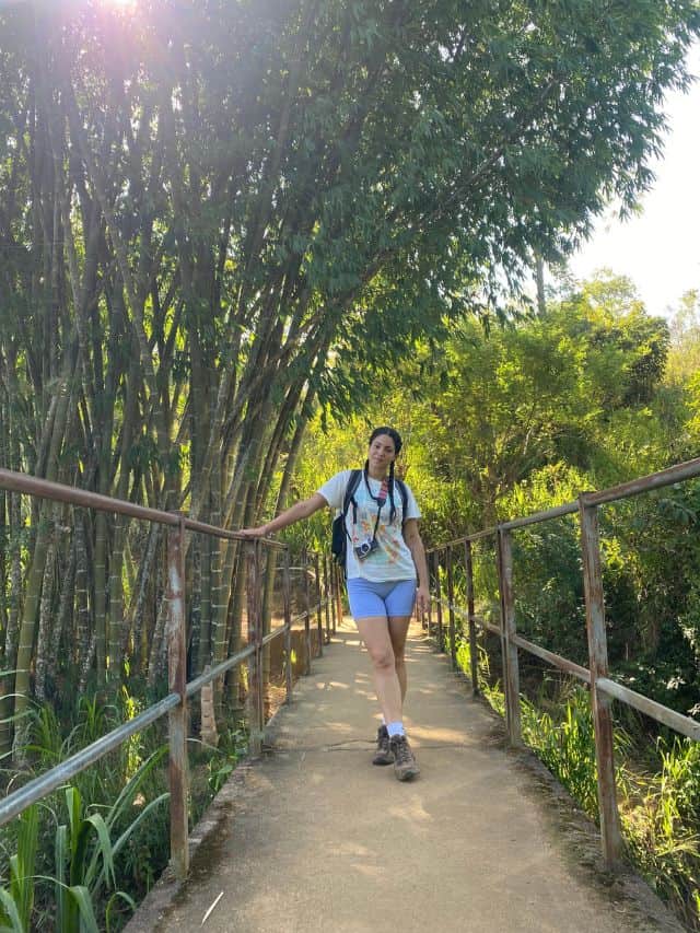Walking along a leafy path in Ella, Sri Lanka, surrounded by bamboo and greenery.