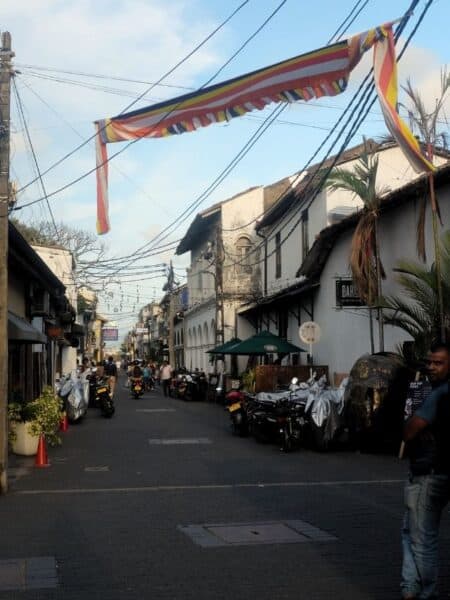 Colonial street inside Galle Fort with bunting and old buildings