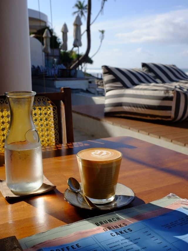 Coffee on table with stripy bean bag and costal vibe