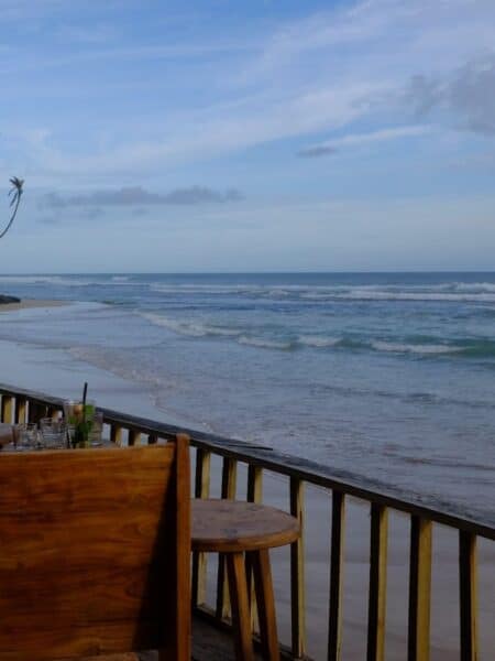 Ocean view from a wooden deck at Ceylon Sliders, Ahangama.