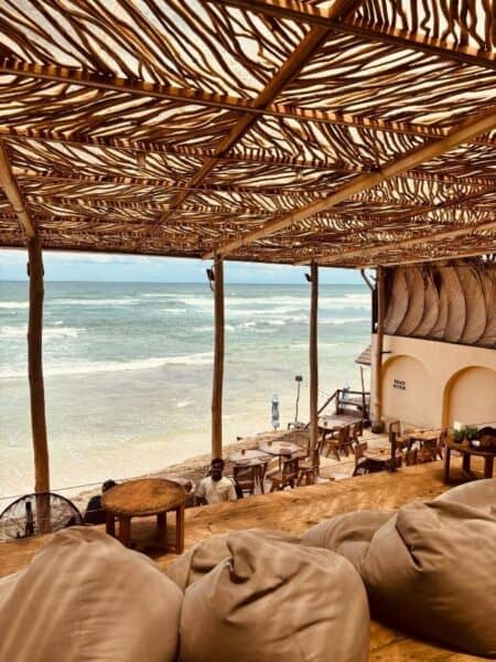 Bean bags and wooden deck overlooking the beach at one of the cafes in Ahangama.
