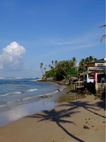 Quiet beach and oceanfront buildings in Ahangama on Sri Lanka’s south coast.