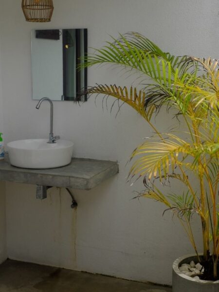 Tropical open-roof shower and bathroom at 7BD Surf House in Sri Lanka.