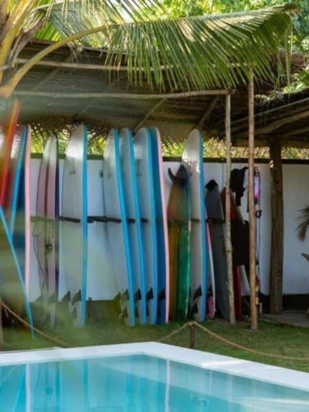 Surfboards beside the pool at 7BD Surf House in Sri Lanka.