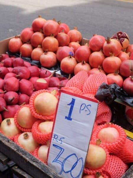 Fresh pomegranates for sale at a Colombo street stall