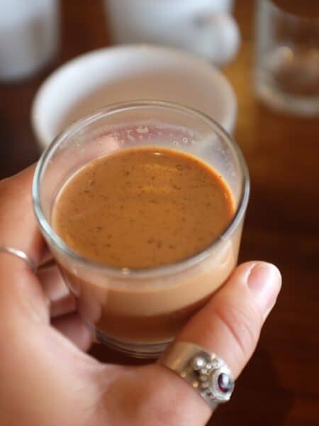 Holding a cup of chai during a tea tasting in Colombo