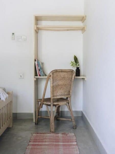Small desk and chair set-up inside a private room at Mellow Hostel Ahangama.